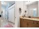 Bathroom includes granite counter, floral shower curtain and well lit mirror at 1825 Epperson Rd, Canton, GA 30115