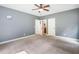 Bedroom features neutral walls, carpet flooring and open doorways at 1825 Epperson Rd, Canton, GA 30115