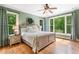 Comfortable bedroom with large windows providing a view of lush greenery at 1825 Epperson Rd, Canton, GA 30115