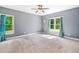 Spacious bedroom with natural light streaming through large windows and soft drapes at 1825 Epperson Rd, Canton, GA 30115