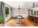Dining room features hardwood floors, wainscoting, and a view of the backyard at 1825 Epperson Rd, Canton, GA 30115