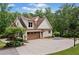 House with concrete driveway and 2 car garage at 1825 Epperson Rd, Canton, GA 30115