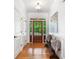 Bright entryway featuring hardwood floors, bench, and front door with sidelights at 1825 Epperson Rd, Canton, GA 30115
