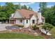 Beautiful home with a brown roof, white siding, attached garage, and an inviting deck overlooking a well-manicured yard at 1825 Epperson Rd, Canton, GA 30115