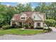 Beautiful home with stone accents and a well-manicured lawn at 1825 Epperson Rd, Canton, GA 30115
