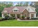 Charming home with stone accents, manicured lawn, and inviting front porch at 1825 Epperson Rd, Canton, GA 30115