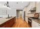 Kitchen with granite counters, a center island, and stainless steel appliances at 1825 Epperson Rd, Canton, GA 30115
