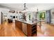 Open concept kitchen boasts a large center island and connects to the dining and living areas at 1825 Epperson Rd, Canton, GA 30115