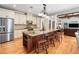 Open kitchen with large center island and stainless steel appliances is perfect for entertaining at 1825 Epperson Rd, Canton, GA 30115