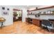 Bright office space with custom built-in shelving, desk and hardwood floors, open to living room at 1825 Epperson Rd, Canton, GA 30115