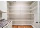 Walk-in pantry with ample shelving for storage and hardwood floors, perfect for organization at 1825 Epperson Rd, Canton, GA 30115