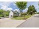 View of the side and front of this well maintained home in a desirable location with mature trees at 2180 Oakpointe Ct, Buford, GA 30519