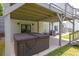 A covered hot tub with stairs to the upper deck is located on a concrete patio at 2180 Oakpointe Ct, Buford, GA 30519