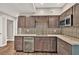 Kitchenette with custom cabinetry, stone countertops, stainless appliances and wine cooler at 2180 Oakpointe Ct, Buford, GA 30519
