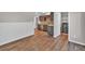 Living space with kitchenette, featuring stainless appliances and door to laundry at 2180 Oakpointe Ct, Buford, GA 30519