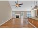 Living room with a fireplace, hardwood floors, and a door leading to the patio at 2180 Oakpointe Ct, Buford, GA 30519