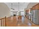 Open concept living space featuring a kitchen, hardwood floors, living room, and dining area at 2180 Oakpointe Ct, Buford, GA 30519