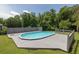 Beautiful backyard featuring a pool and deck with green landscaping at 2180 Oakpointe Ct, Buford, GA 30519