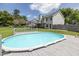 Backyard showcasing pool, wooden deck and home exterior at 2180 Oakpointe Ct, Buford, GA 30519