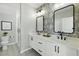 Modern bathroom with dual sinks, stylish fixtures, and a glass-enclosed shower at 407 Pratt Se Dr # 1101, Atlanta, GA 30315