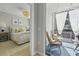 Beautiful bedroom with a plush bed, side tables and a gorgeous view of the exterior balcony with comfortable seating at 407 Pratt Se Dr # 1101, Atlanta, GA 30315