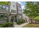 Attractive multi-story townhome showcasing a well-maintained yard, inviting entrance and modern design at 407 Pratt Se Dr # 1101, Atlanta, GA 30315