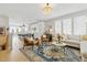 Bright and stylish living room seamlessly connects to the modern kitchen with lots of seating at 407 Pratt Se Dr # 1101, Atlanta, GA 30315