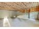 Unfinished basement offering potential for customization and expansion with insulation installed in the ceiling and walls at 70 Wheeler Lake Path, Dallas, GA 30157
