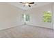Spacious bedroom with a ceiling fan and bright, natural light from several windows at 70 Wheeler Lake Path, Dallas, GA 30157