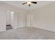 Spacious bedroom with neutral carpet and multiple doorways, including one to an ensuite bathroom at 70 Wheeler Lake Path, Dallas, GA 30157