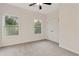 Neutral bedroom featuring gray carpeting and a closet with double doors at 70 Wheeler Lake Path, Dallas, GA 30157
