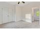 Bedroom featuring gray carpeting and a closet with double doors at 70 Wheeler Lake Path, Dallas, GA 30157