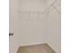 Walk-in closet with carpeting and shelving for efficient storage at 70 Wheeler Lake Path, Dallas, GA 30157