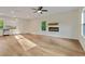 Open-concept kitchen and living room with modern fireplace, lots of natural light and hardwood flooring at 70 Wheeler Lake Path, Dallas, GA 30157