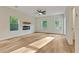 Spacious living room with a modern fireplace, lots of natural light and hardwood flooring at 70 Wheeler Lake Path, Dallas, GA 30157