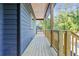 New home porch with wood decking and railings provides space for outdoor enjoyment and complements the home's exterior at 70 Wheeler Lake Path, Dallas, GA 30157