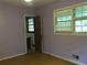 Bedroom leading to bathroom with natural light at 135 Golden Hills Dr, Woodstock, GA 30189