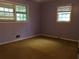Bedroom with two windows providing natural light at 135 Golden Hills Dr, Woodstock, GA 30189