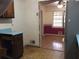 The kitchen leads into a living area with colorful wall decorations and a window at 135 Golden Hills Dr, Woodstock, GA 30189
