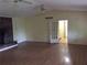 Spacious living room featuring a brick fireplace and hardwood floors at 135 Golden Hills Dr, Woodstock, GA 30189