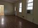 Inviting living room with hardwood floors and natural light from two windows at 135 Golden Hills Dr, Woodstock, GA 30189