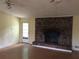 Living room with fireplace, wood floors, and a door leading to the outside at 135 Golden Hills Dr, Woodstock, GA 30189