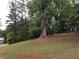 Grassy yard with mature trees at 135 Golden Hills Dr, Woodstock, GA 30189