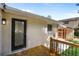 Exterior view of the backyard featuring a wooden deck and freshly painted brick at 2148 Green Forrest Dr, Decatur, GA 30032