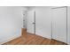 Bedroom with wood floors, white trim, closets, and doorways with updated hardware at 2148 Green Forrest Dr, Decatur, GA 30032