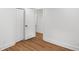 A bedroom with wood floors, and fresh white paint has ample closet space at 2148 Green Forrest Dr, Decatur, GA 30032