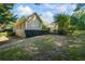 Beautiful backyard showing the exterior of the home with a deck, lush greenery, and well-maintained lawn at 2191 Flowering Dr, Grayson, GA 30017