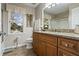 Bathroom featuring wood look floors, wooden vanity, and granite countertop at 2191 Flowering Dr, Grayson, GA 30017