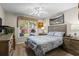 Cozy bedroom featuring a ceiling fan, a comfortable bed, and a picturesque window view at 2191 Flowering Dr, Grayson, GA 30017