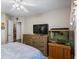 Bedroom showcasing a large dresser with a TV, and an aquarium at 2191 Flowering Dr, Grayson, GA 30017
